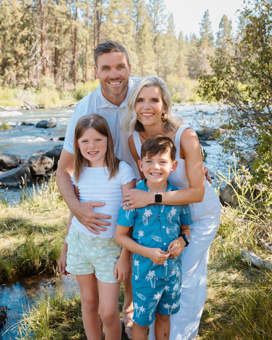 Brendan with his wife Jen and their two children by a river