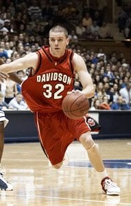 Brendan dribbling in his red Davidson #32 jersey